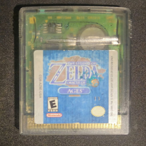The Legend of Zelda Oracle of Ages Game Boy Color cartridge and manual