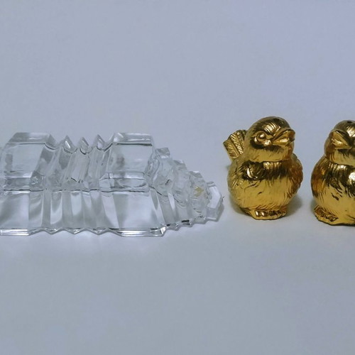 Set of gilded miniature salt and pepper shakers with lead tray