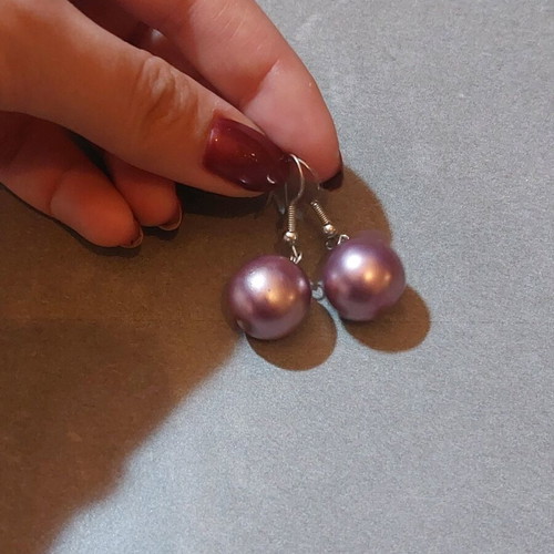 Dangling earrings used with purple and silver beads