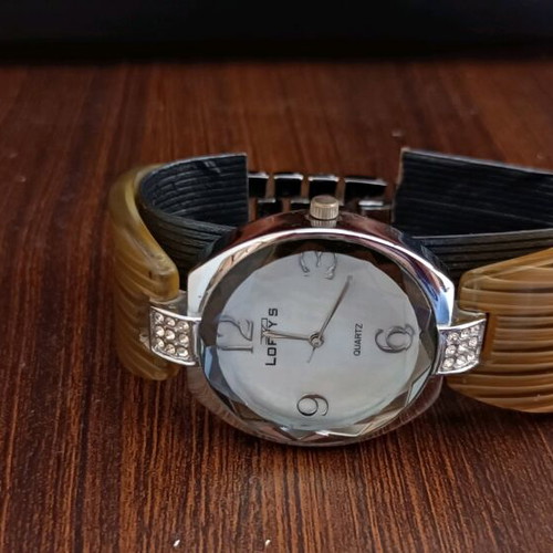 Women's watch like new with silver and bone bracelet