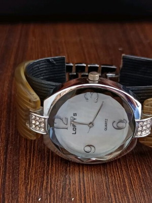 Women's watch like new with silver and bone bracelet