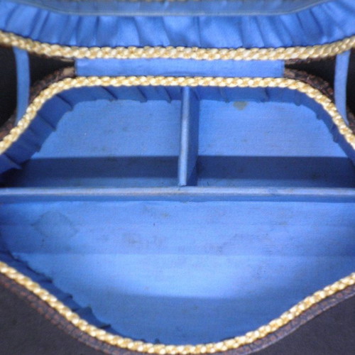 Antique jewelry box used, brown color with blue fabric interior