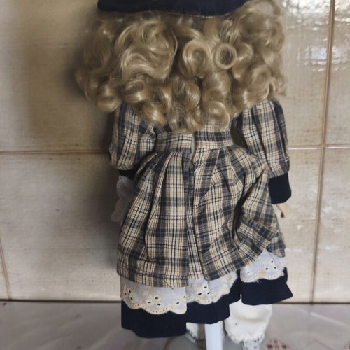 Porcelain doll vintage collective used with dress stains