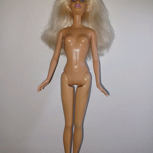 Barbie doll used with mark on knee