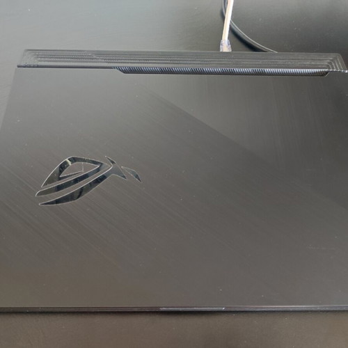 ASUS ROG Strix G531GT gaming laptop with headphones and keyboard