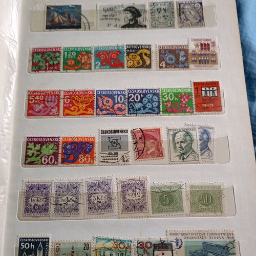 Two stamp albums with stamps from around the world