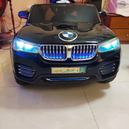 BMW X6 electric ride-on car like new with remote control and LED lights