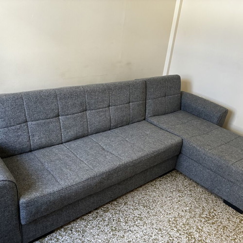 Corner sofa bed with storage compartments