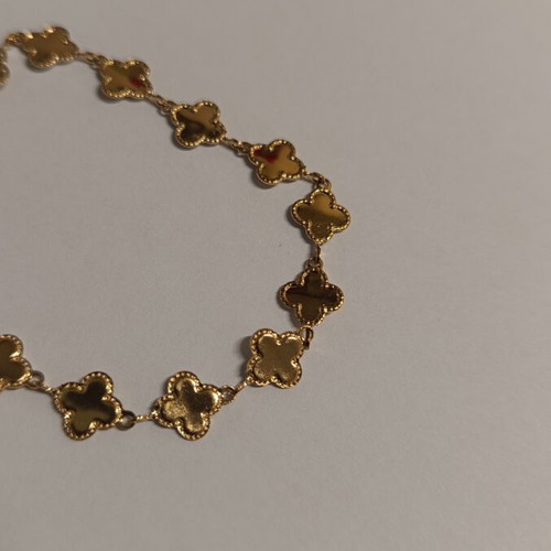 Gold bracelet with four-leaf clover design, brand new