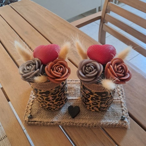 Decorative candle with wax flowers