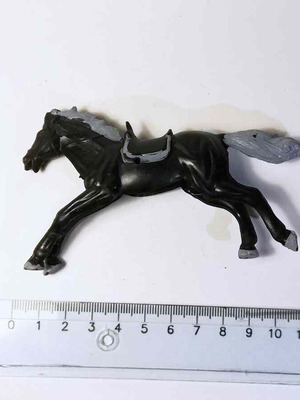 Plastic horse toy used with scratches and marks
