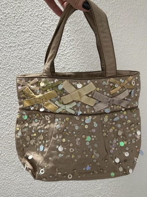 Accessorize vintage handbag like new, beige with bows