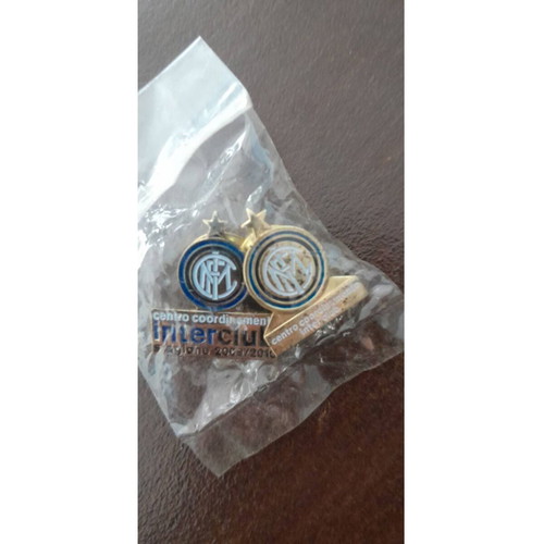 Inter collection with scarves, pennants, cufflinks, magazines and backpack