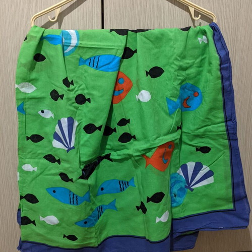 Pareo with bright fish pattern, blue and green