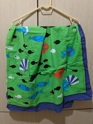 Pareo with bright fish pattern, blue and green