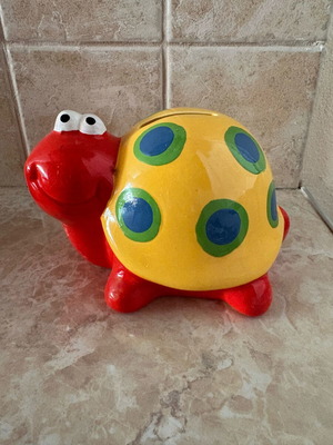 Ceramic snail piggy bank