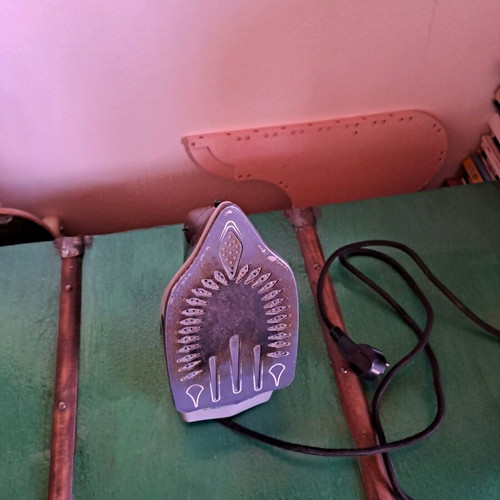 Steam iron used, as shown