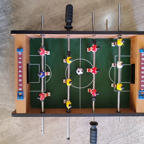 Wooden foosball table used with 1 ball, missing two plastic handles