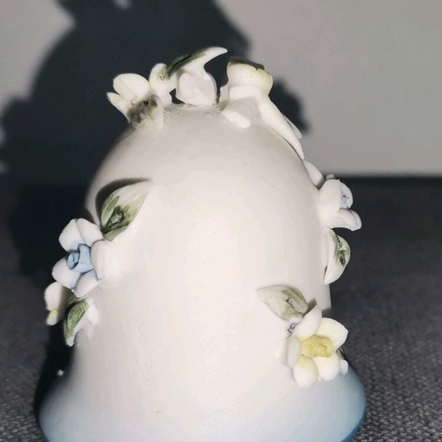 Ceramic bell used with embossed flower designs