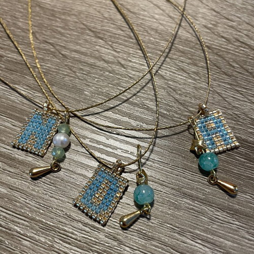 Monogram necklaces with Miyuki beads and metal elements