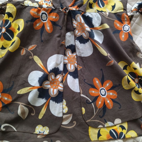 Please top like new, women's with adjustable ties, colorful