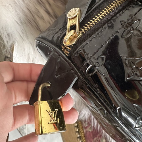 Louis Vuitton old black bag with gold accessories