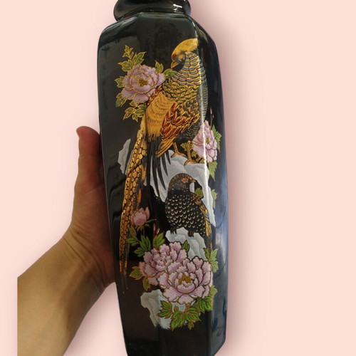 Black vase with golden embossed paintings