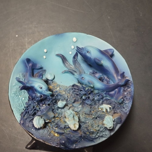 Decorative plate used with dolphins