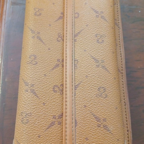 Wallet used camel color with many pockets and minor defect