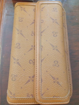 Wallet used camel color with many pockets and minor defect
