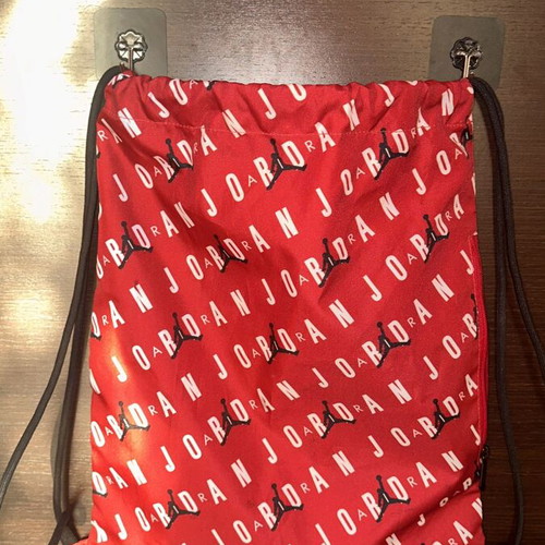 Jordan gym bag like new, red backpack