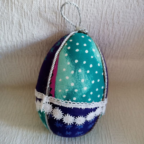 Decorative egg used blue light blue with stars and lace