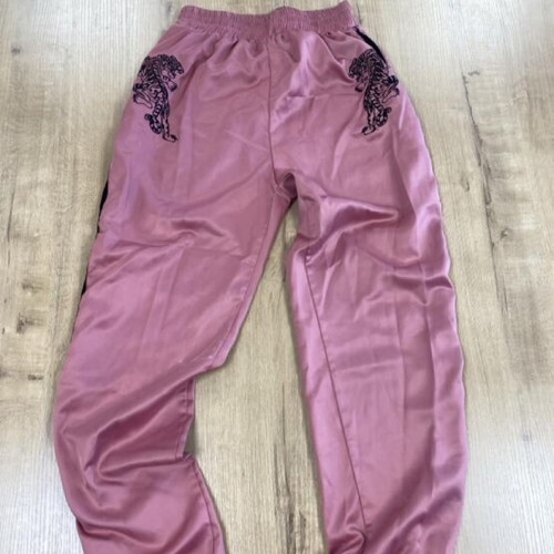 Pink sweatpants with black tiger graphic