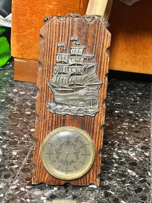 Vintage nautical wall thermometer with wooden base and sailboat