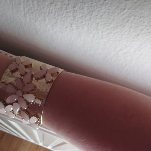 Gold bracelet with pink details