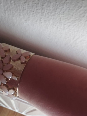 Gold bracelet with pink details