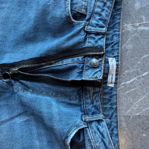Women's blue jeans with rips and unique zipper like new