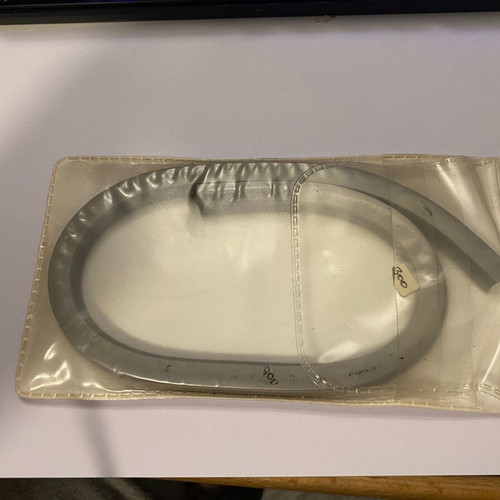 Vintage flexible curve used for technical drawing, metal drafting tool