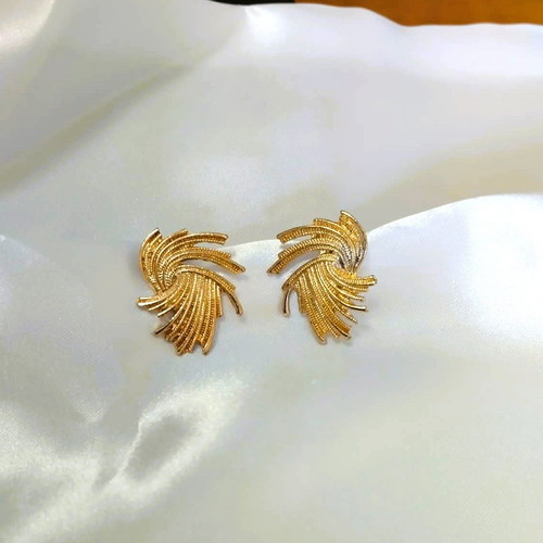 Twisted swirl earrings gold color new