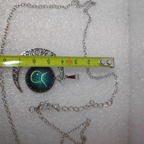 Pendant necklace with Taurus zodiac and crescent moon, like new