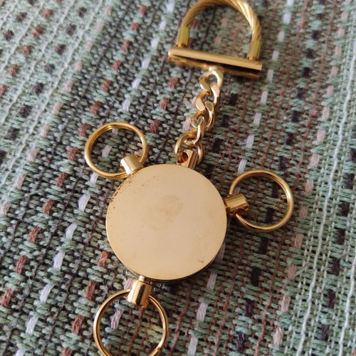 Deluxe keychain with case, like new, gold tone