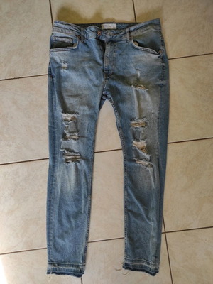 Jean with ripped design new, size 44