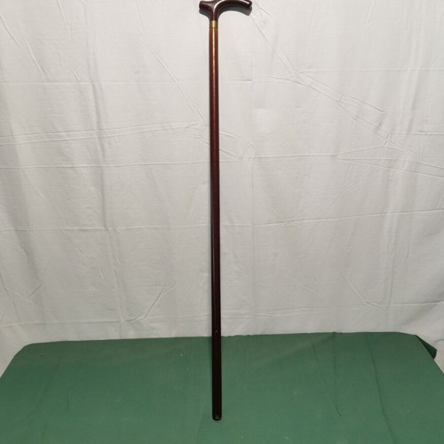 Wooden walking cane used, dark brown color