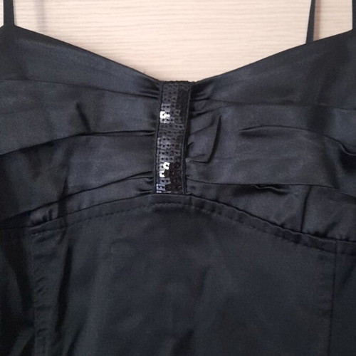 Mini black dress like new, size M, with side zipper and ruffles