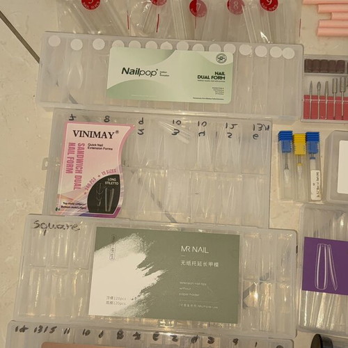 Nail products set like new with dual forms, tips, and accessories