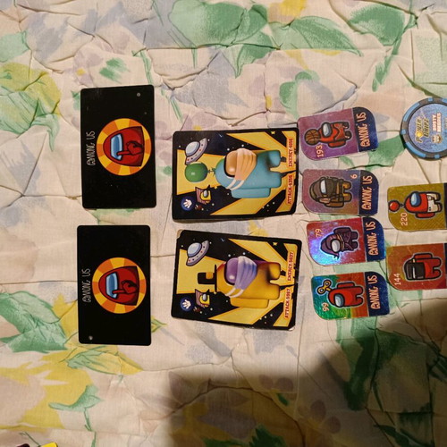 Among Us used 6 metal tokens, 2 cards, 2 papers