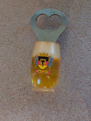 Decorative bottle opener used with wear around the magnet