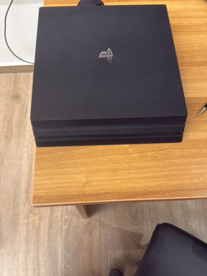 PlayStation 4 Pro like new with 2 controllers and 3 DVDs