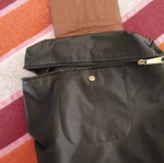 Black backpack with brown flap