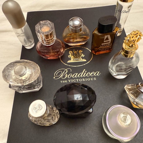 Collection of 11 authentic miniature perfumes like new